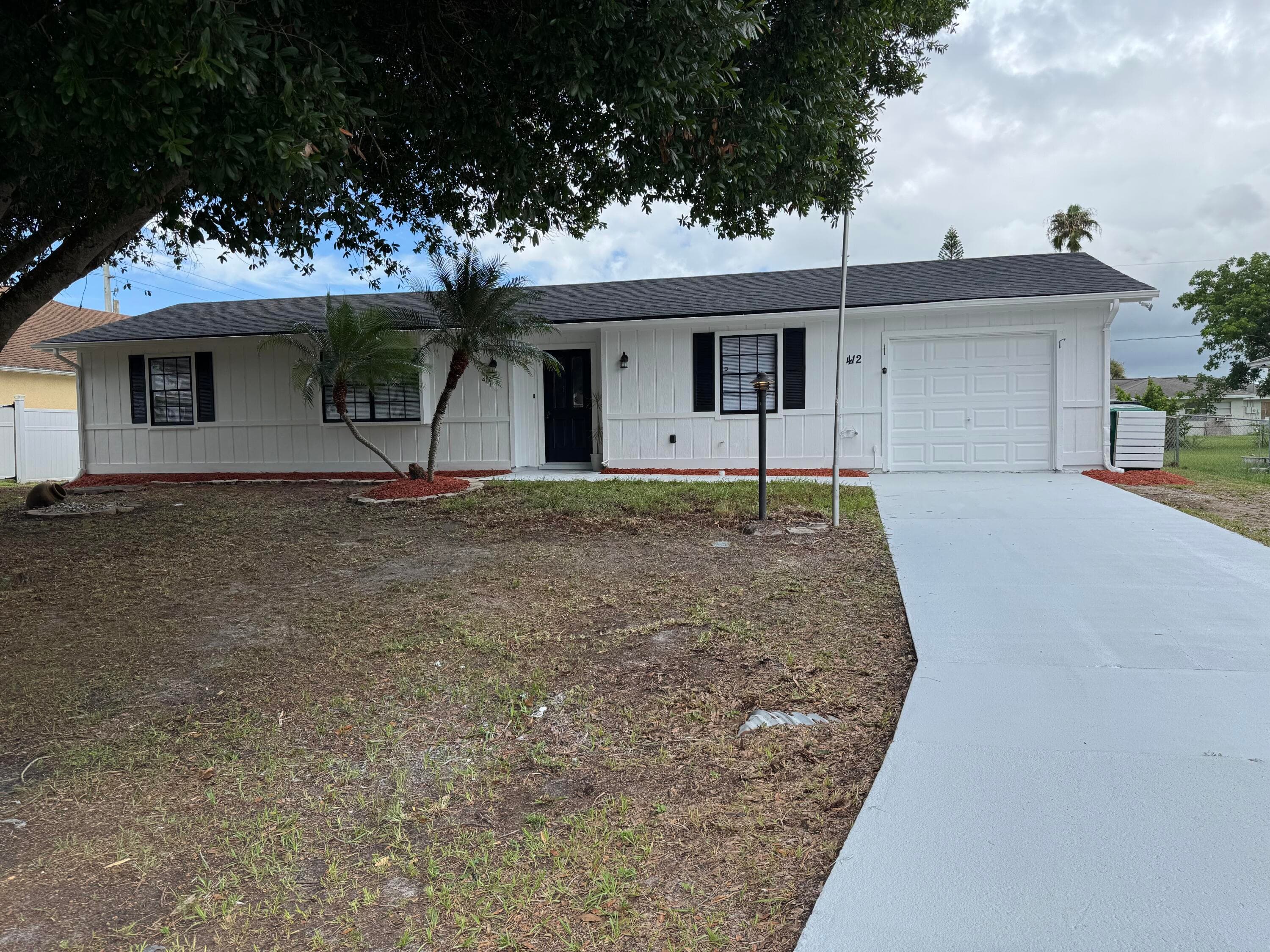 412 NE Midvale Street, Port St. Lucie, FL 34983 — photo 1 of 27