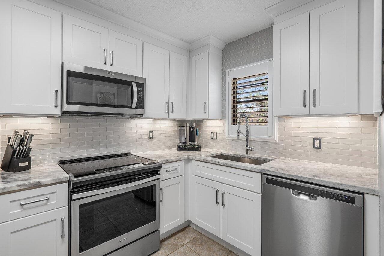 2420 Deer Creek Country Club Boulevard 205-D, Deerfield Beach, FL 33442 — photo 1 of 49