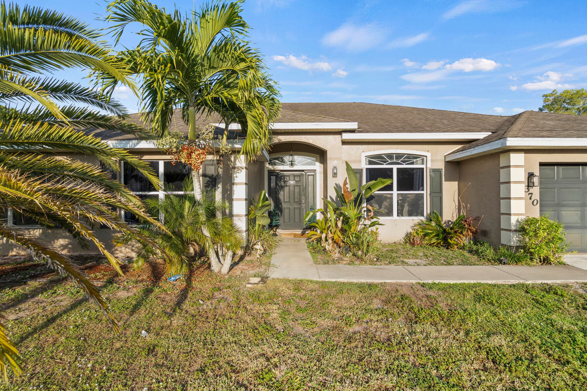 370 SW Tulip Boulevard, Port St. Lucie, FL 34953 — photo 1 of 64