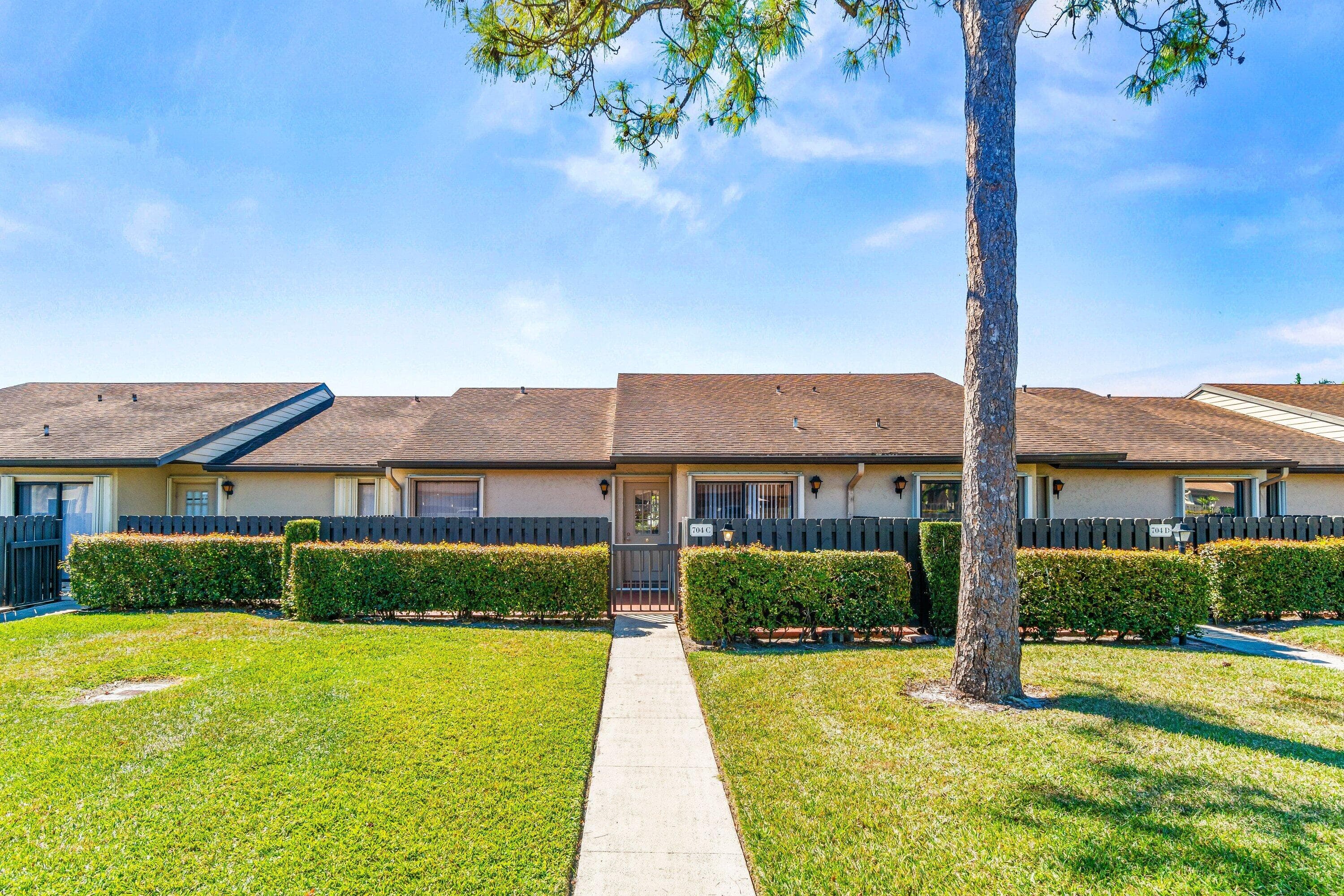 704 Sunny Pine Way C, Greenacres, FL 33415 — photo 1 of 40