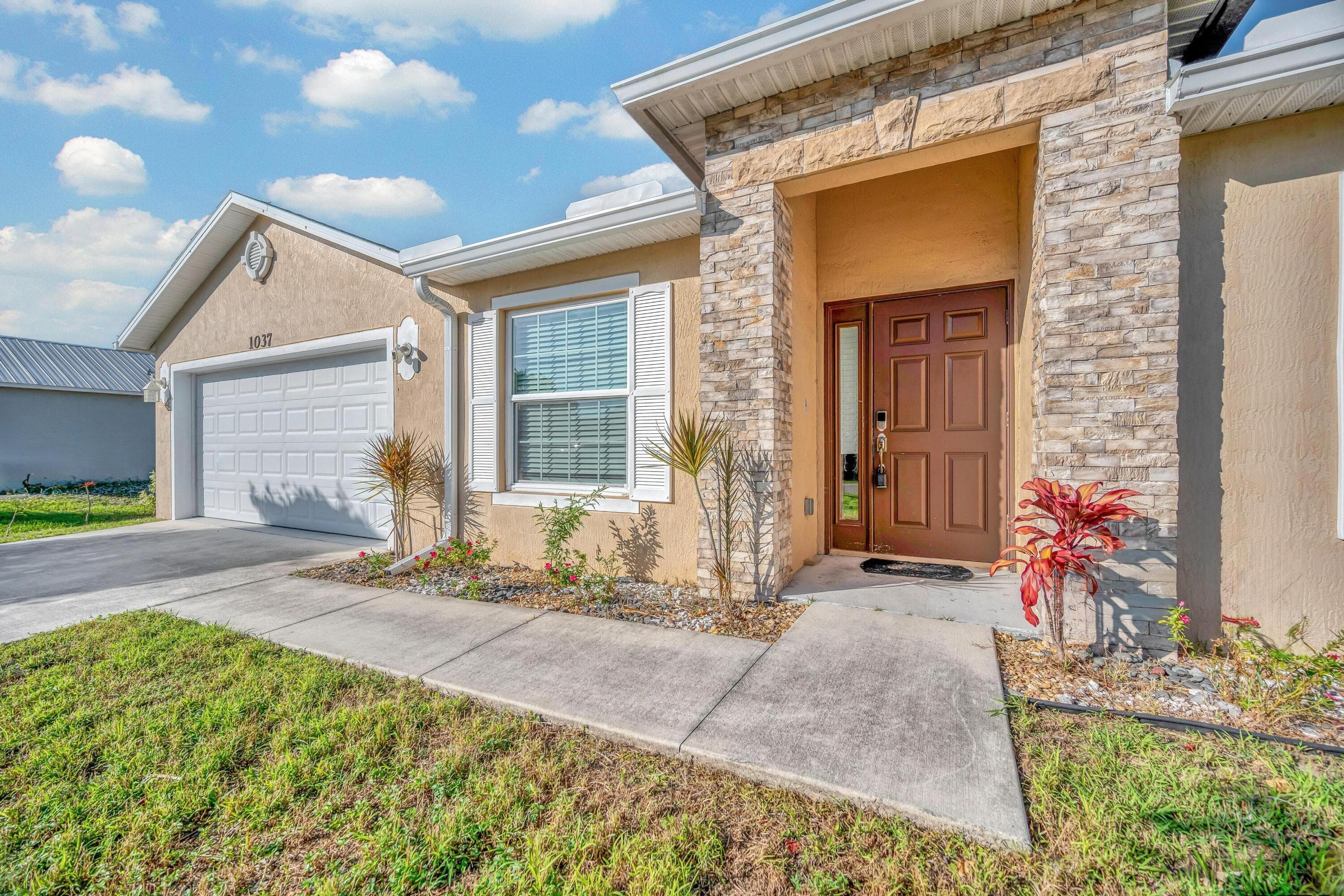 1037 SW Payne Avenue, Port St. Lucie, FL 34953 — photo 1 of 27