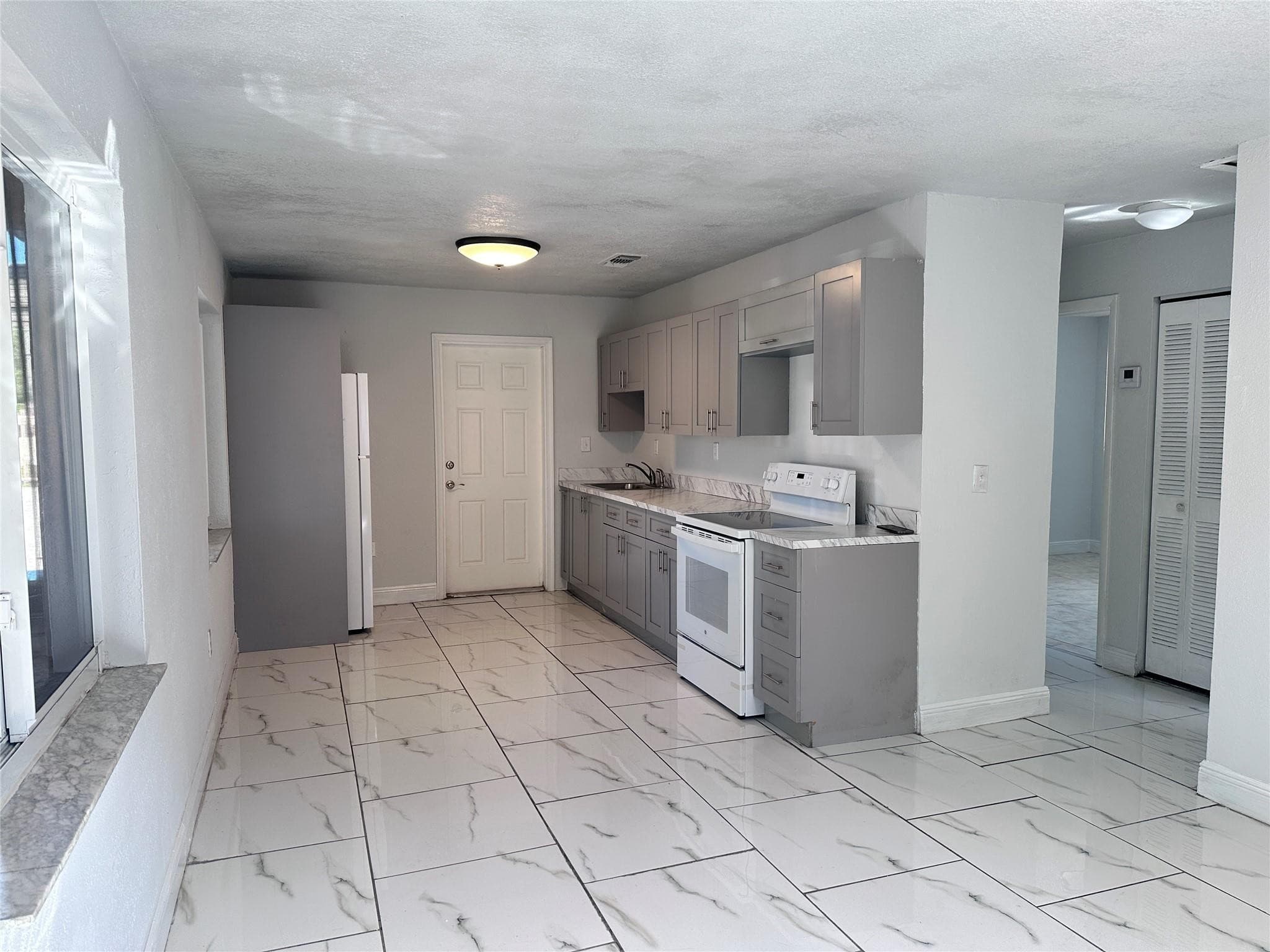 410 NW 33rd Street, Miami, FL 33127 — photo 4 of 9