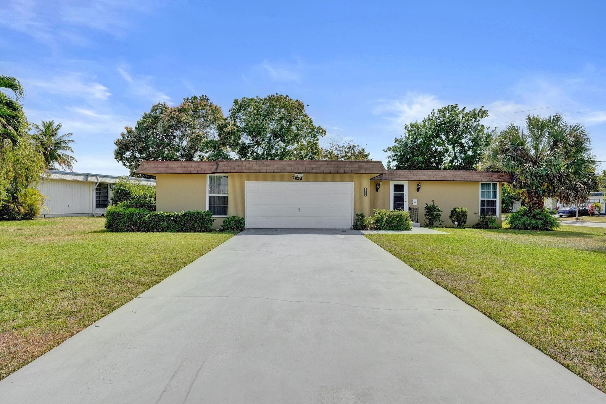 7018 NW 64th Street, Tamarac, FL 33321 — photo 1 of 51