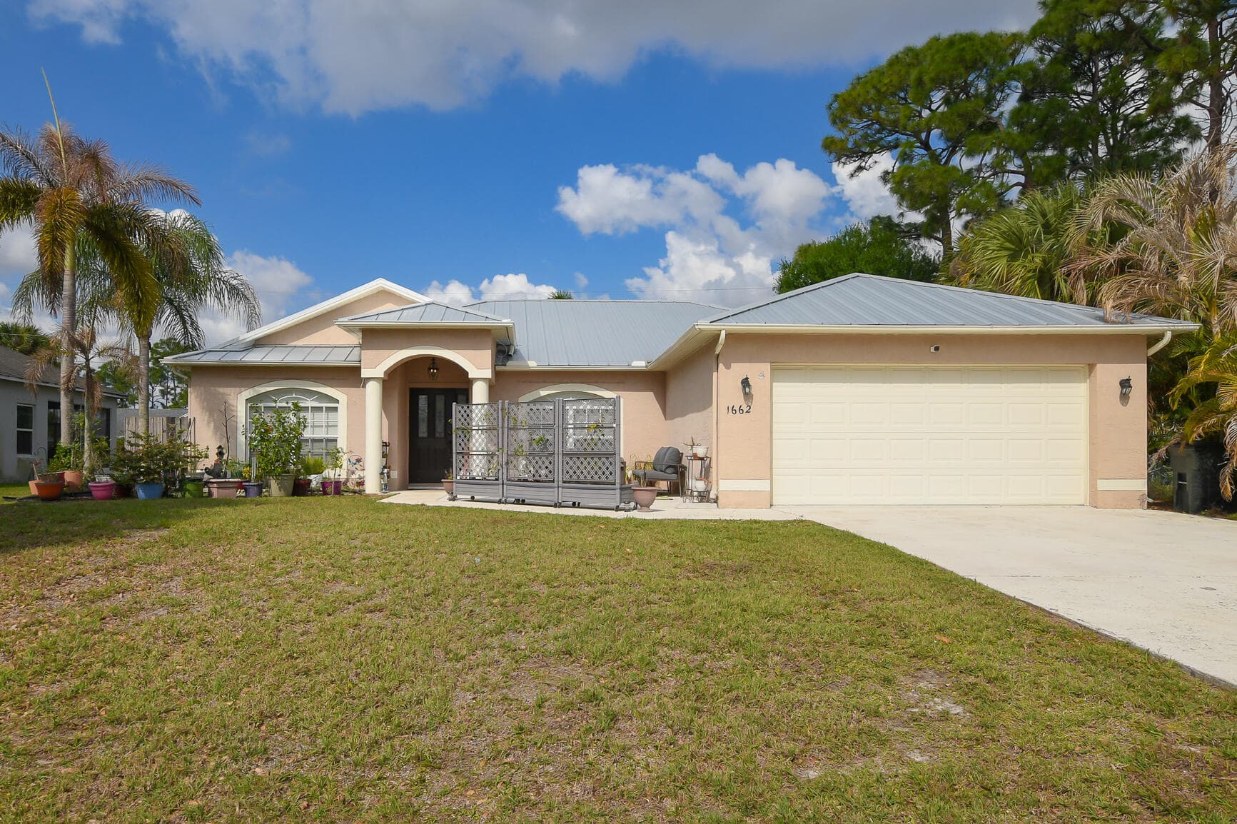 1662 SW Rutland Street, Port St. Lucie, FL 34987 — photo 1 of 40