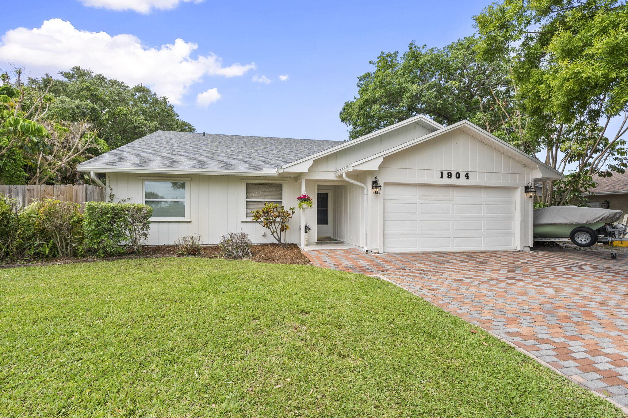 1904 NE Avenida Dracaena, Jensen Beach, FL 34957 — photo 1 of 32
