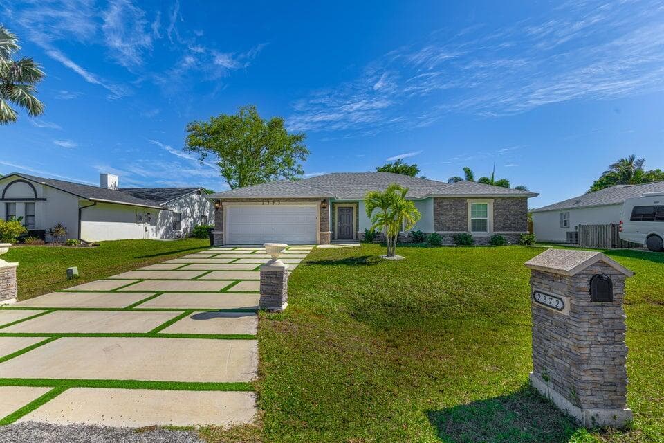 2372 SE Maslan Avenue, Port St. Lucie, FL 34952 — photo 1 of 44