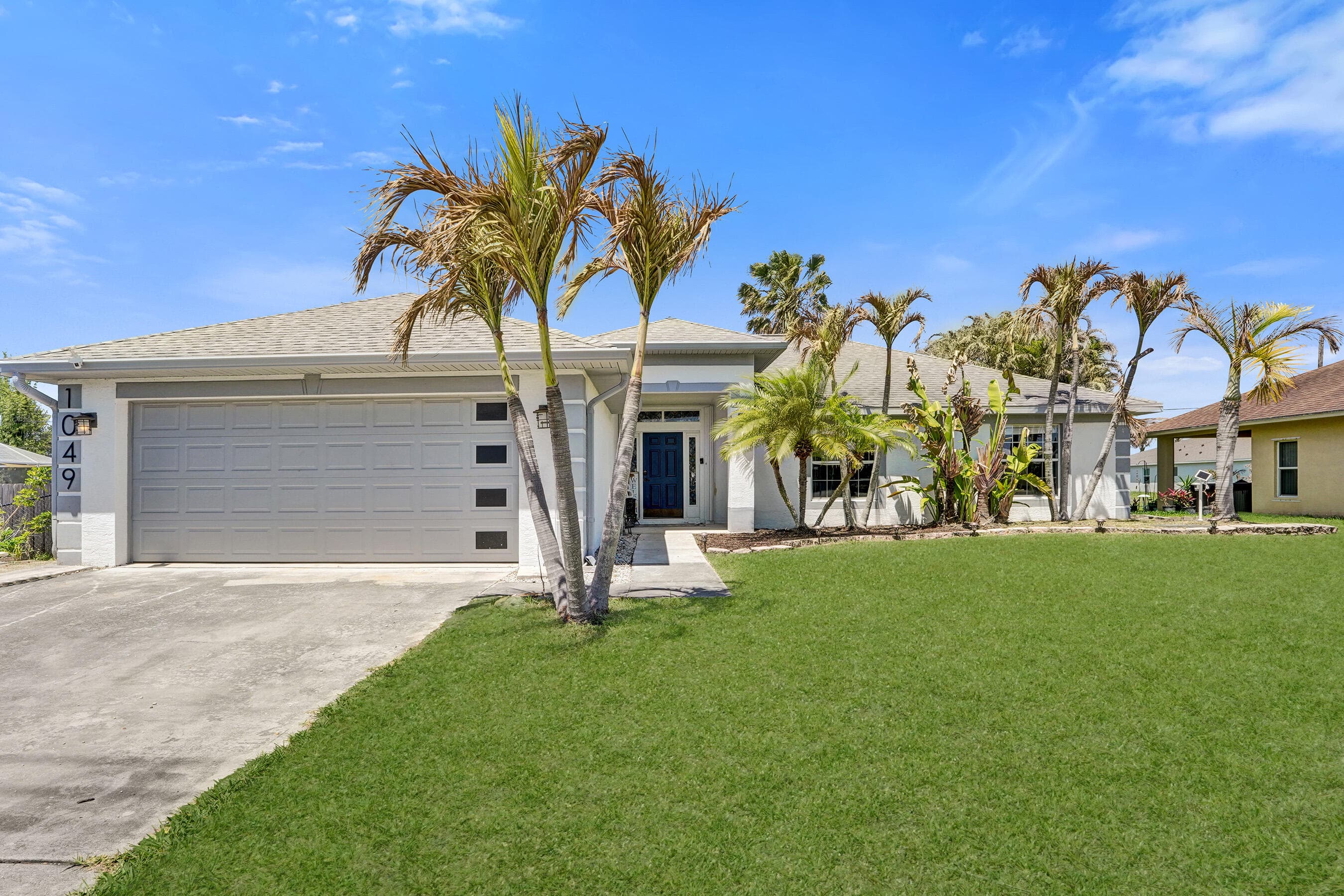 1049 SW Alcantarra Boulevard, Port St. Lucie, FL 34953 — photo 1 of 18