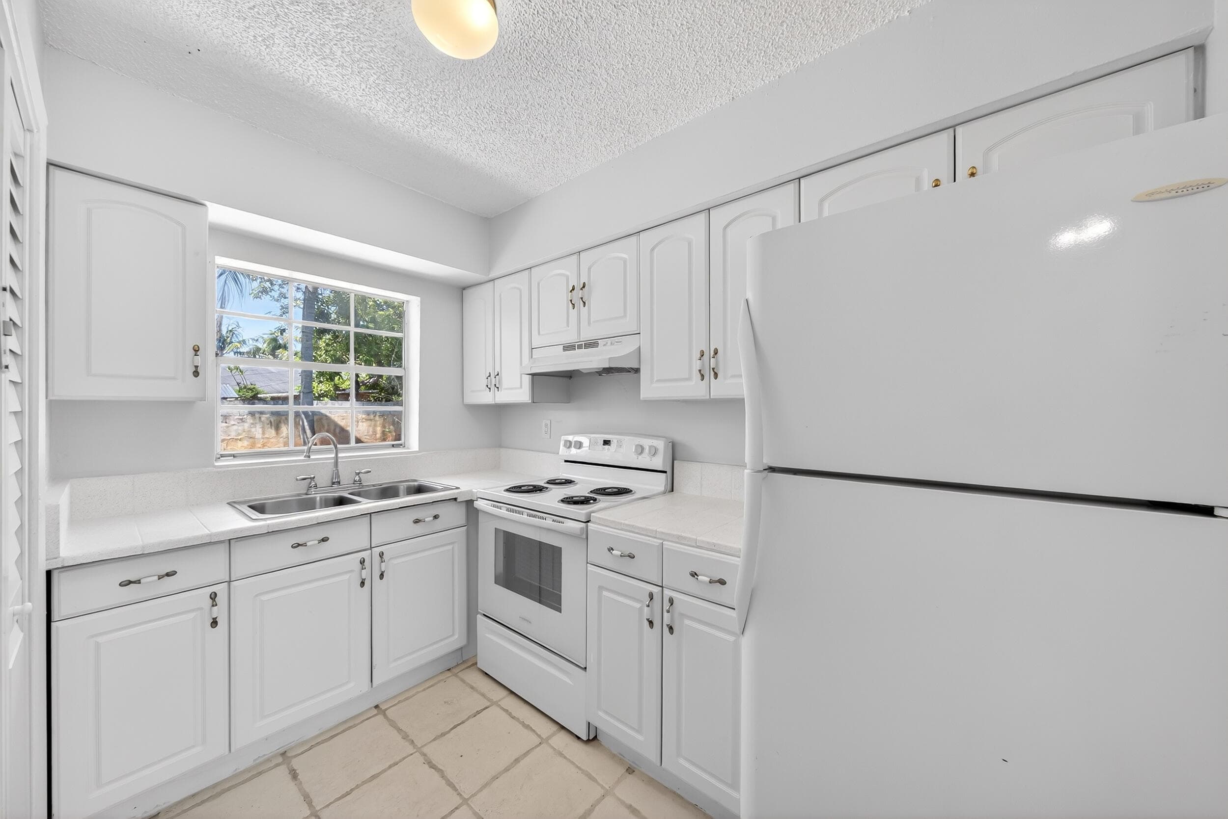 121 NW 56th Court 1-2, Oakland Park, FL 33309 — photo 4 of 24