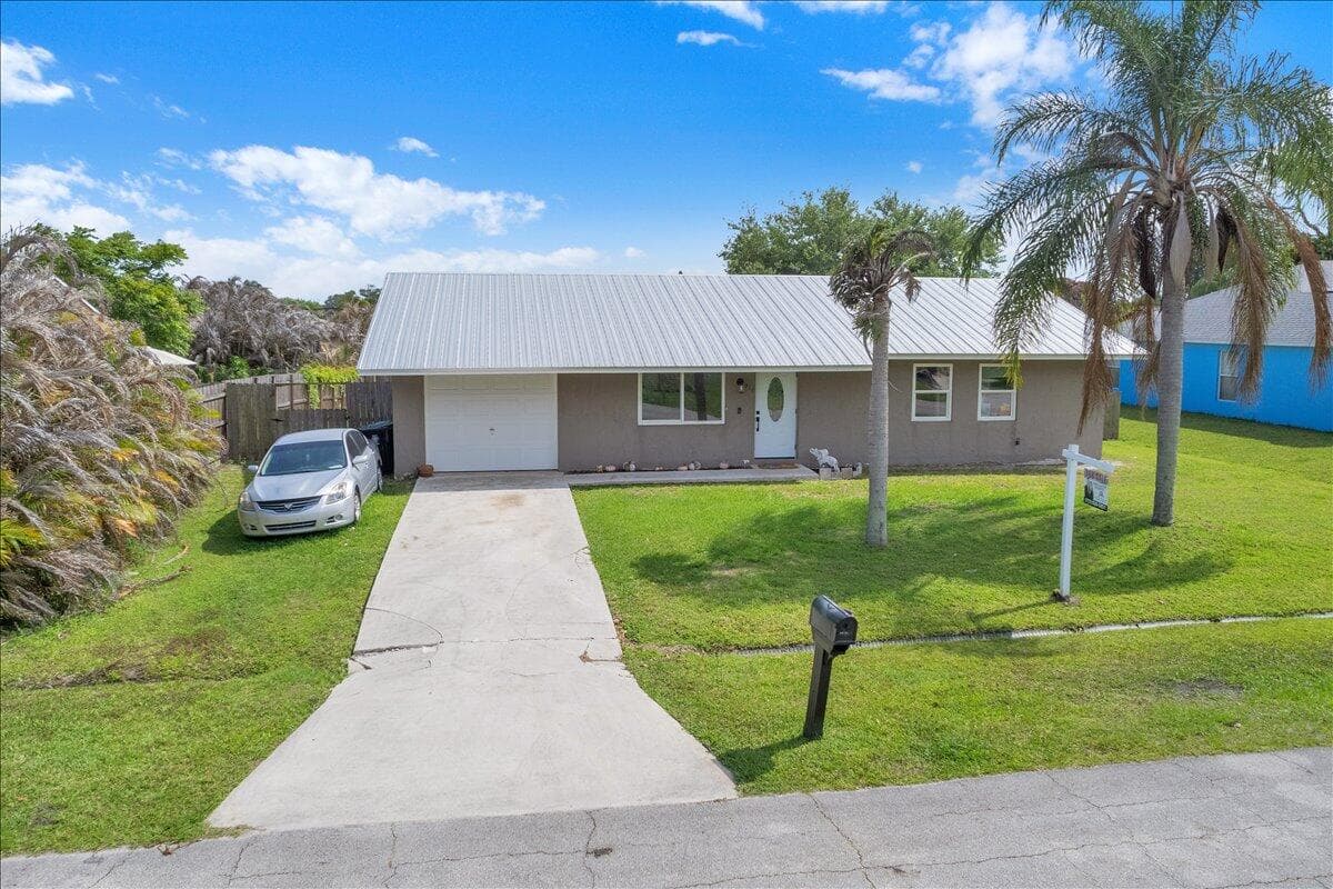 956 SE Browning Avenue, Port St. Lucie, FL 34983 — photo 1 of 58