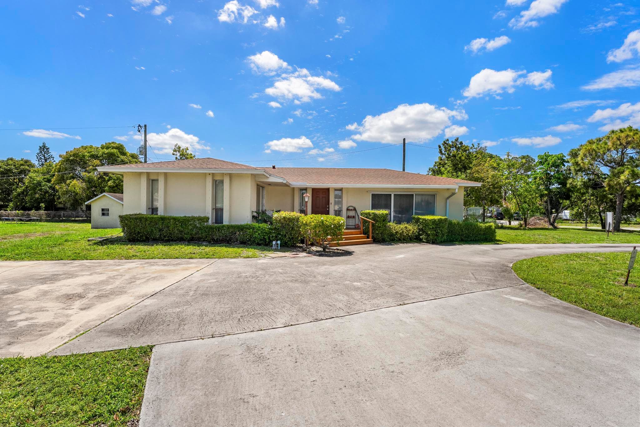 1675 E Breezy Lane, West Palm Beach, FL 33417 — photo 1 of 56