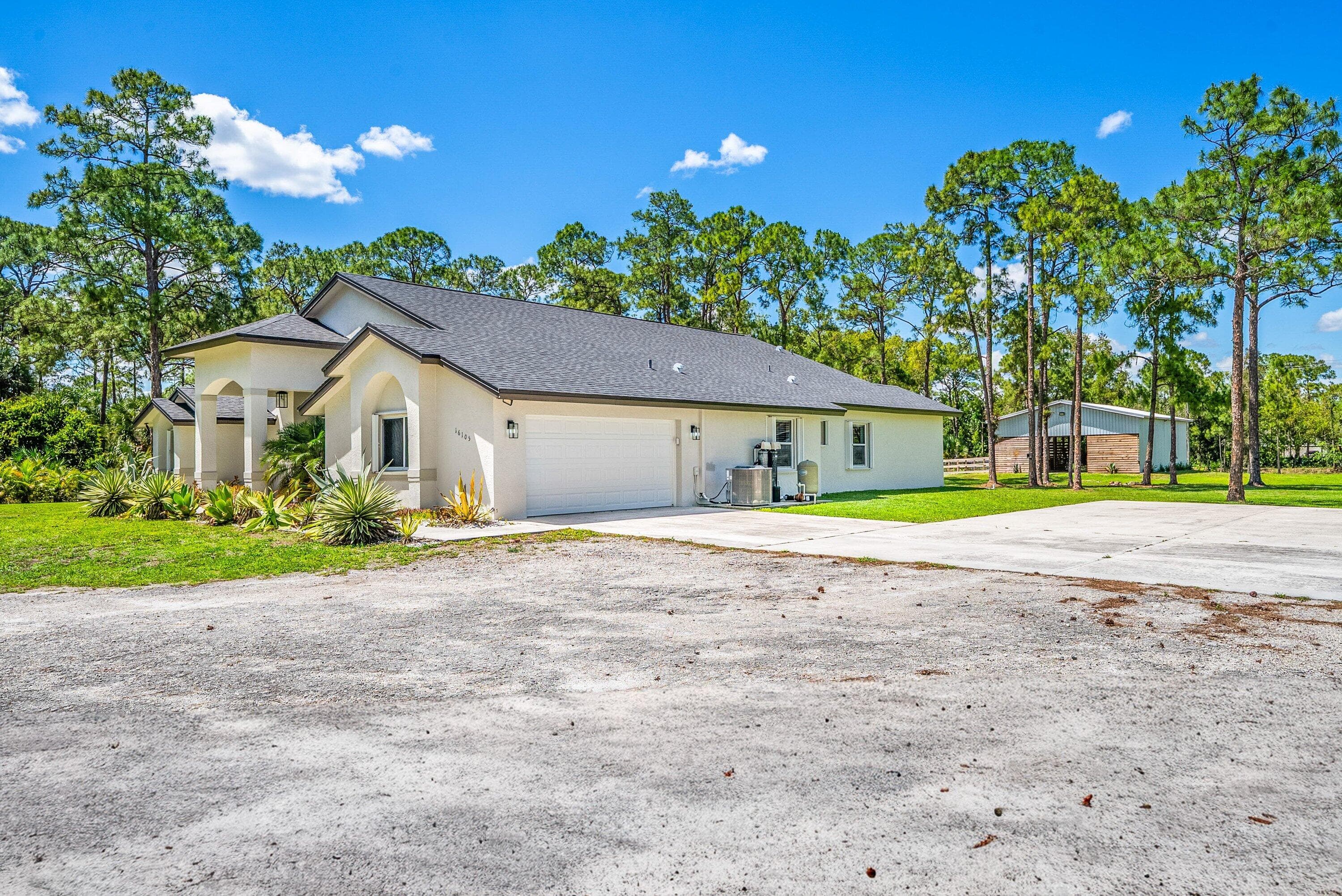 16105 Temple Boulevard, The Acreage, FL 33470 — photo 11 of 77