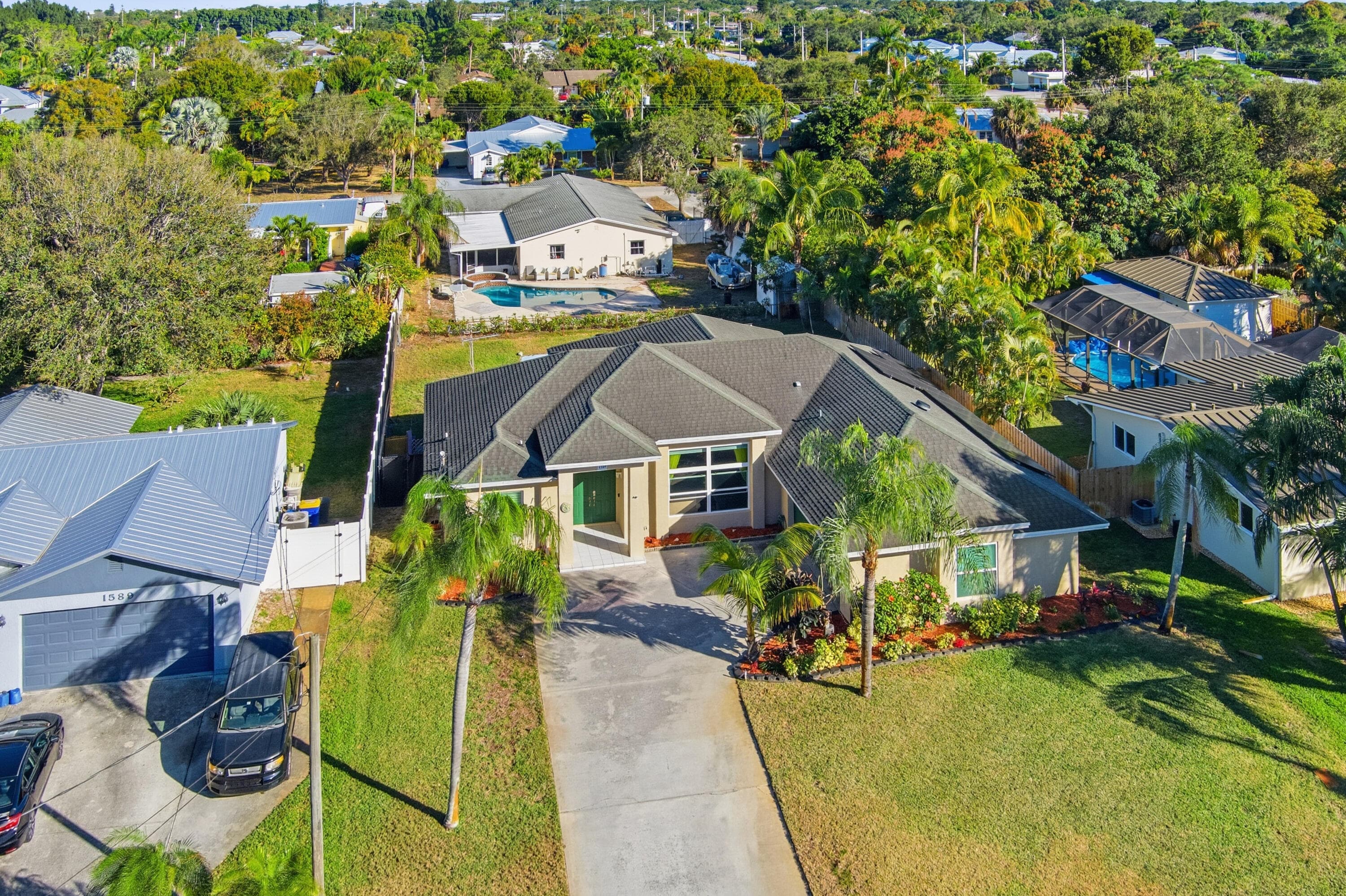 1569 NE Amy Avenue, Jensen Beach, FL 34957 — photo 1 of 30
