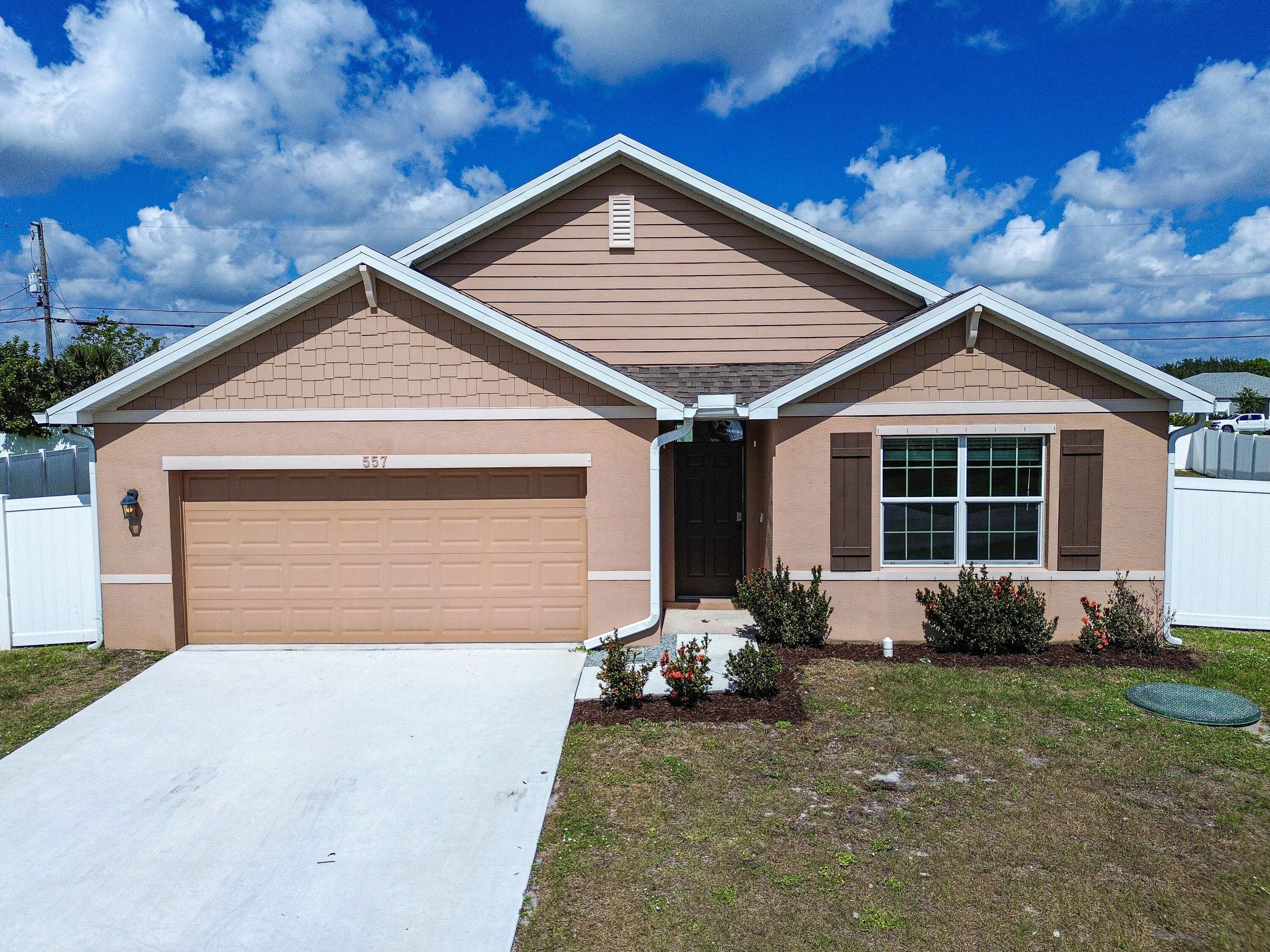 557 SW Columbus Drive, Port St. Lucie, FL 34953 — photo 1 of 54