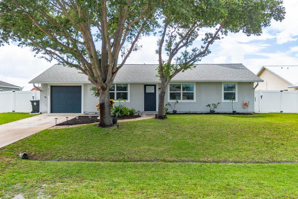 2590 SW Hinchman Street, Port St. Lucie, FL 34984 — photo 1 of 54