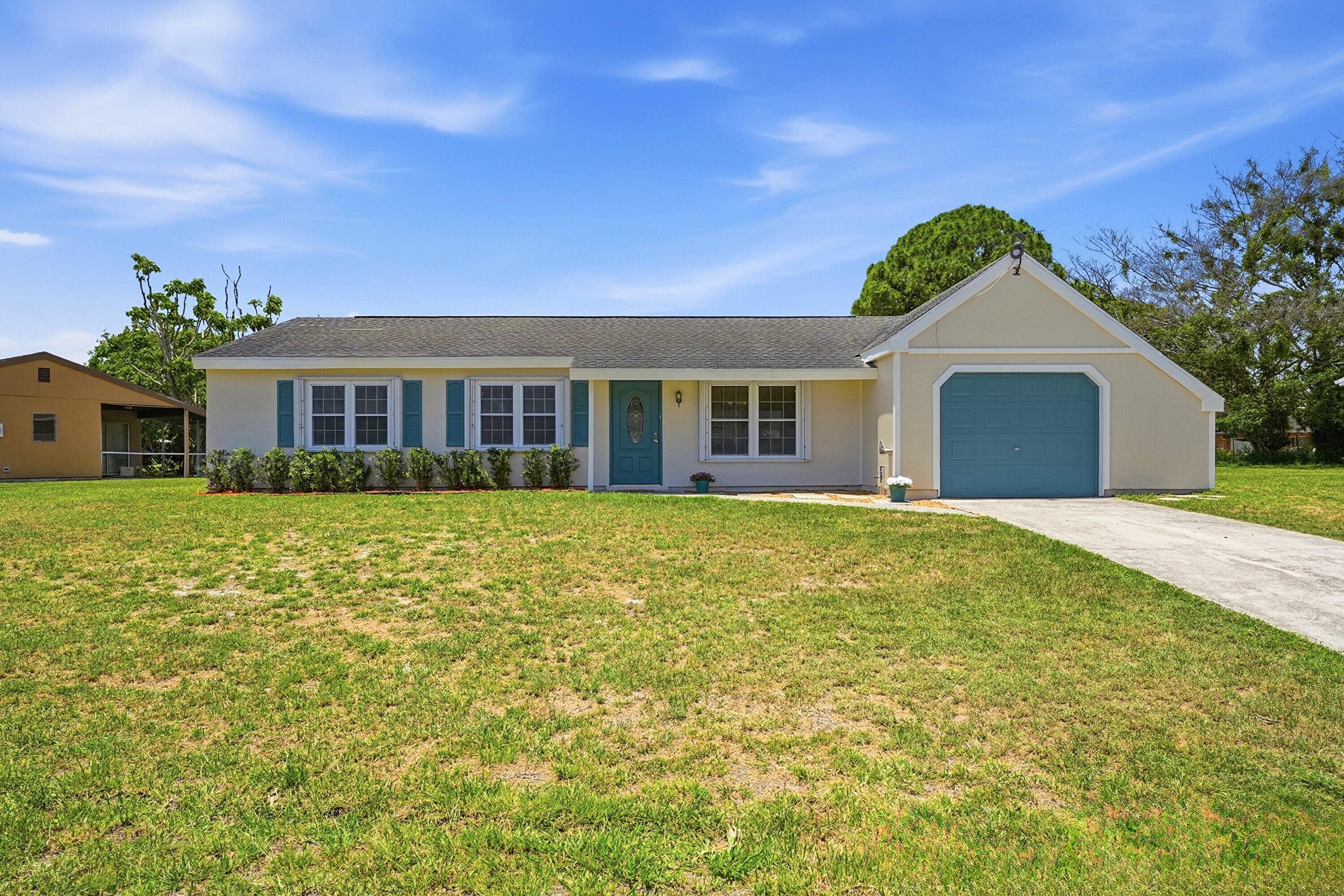 450 SW Kentwood Road, Port St. Lucie, FL 34953 — photo 1 of 49