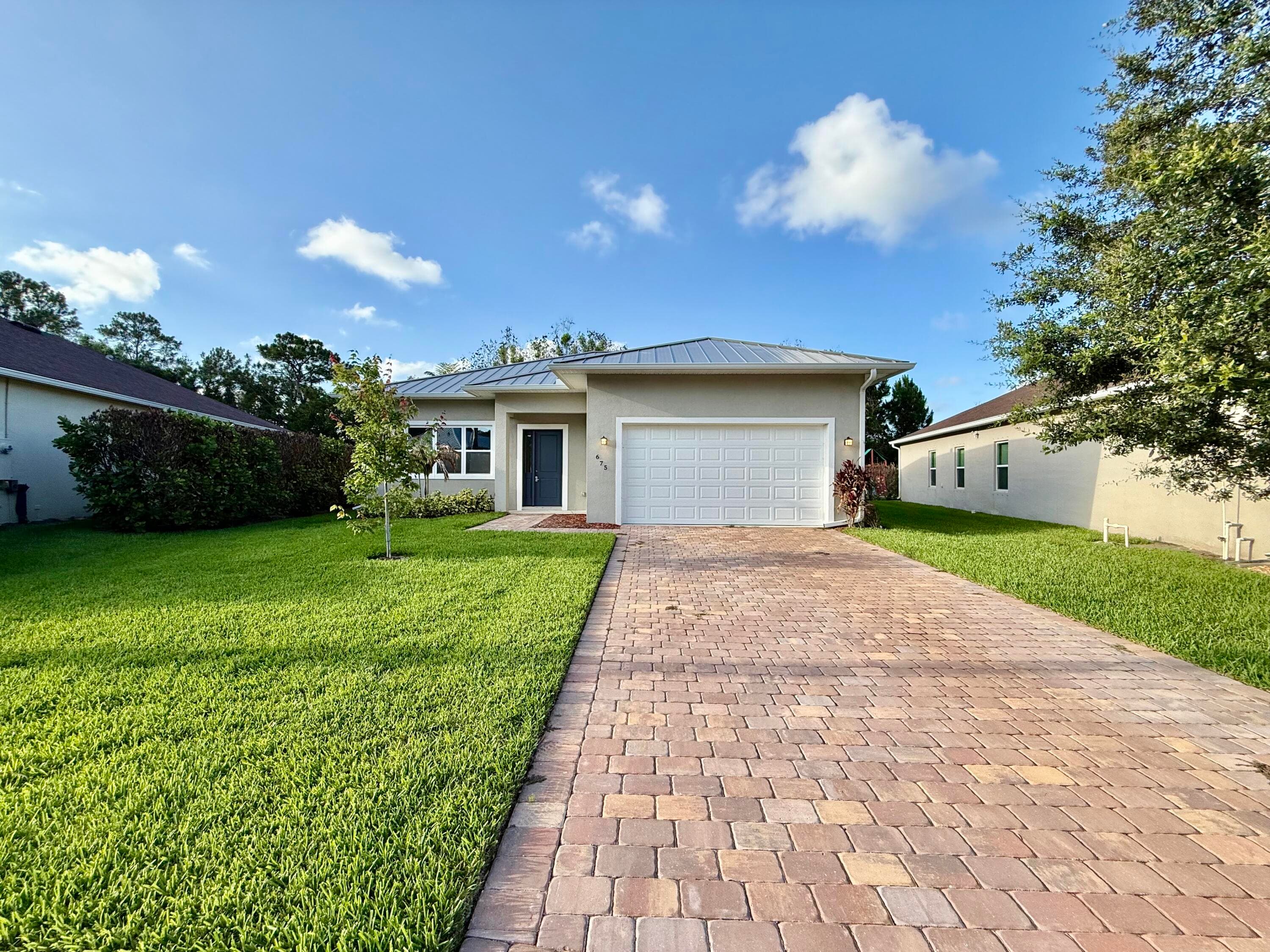 675 NE Moss Rose Place, Port St. Lucie, FL 34983 — photo 1 of 26