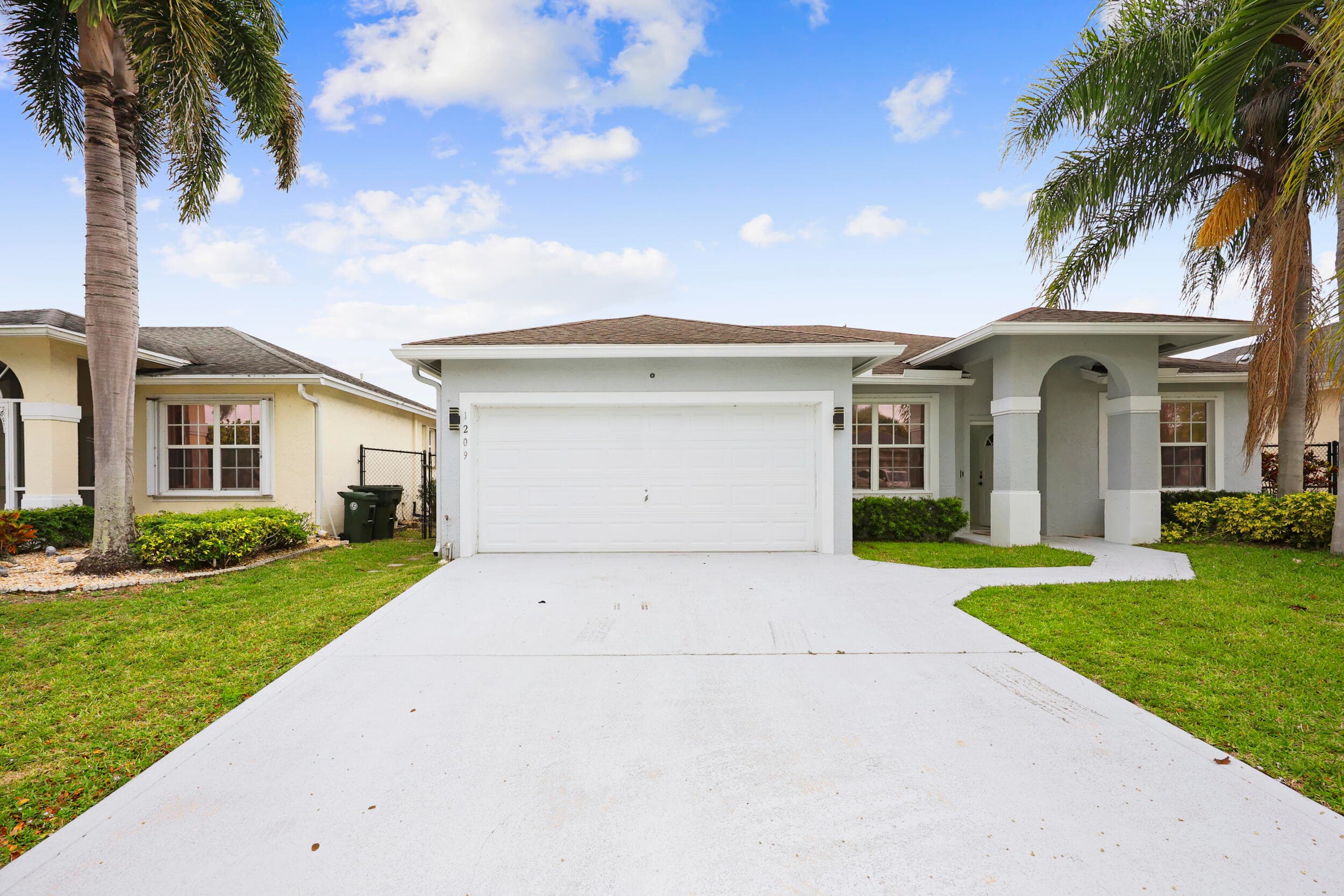 1209 Olympic Circle, Greenacres, FL 33413 — photo 1 of 56