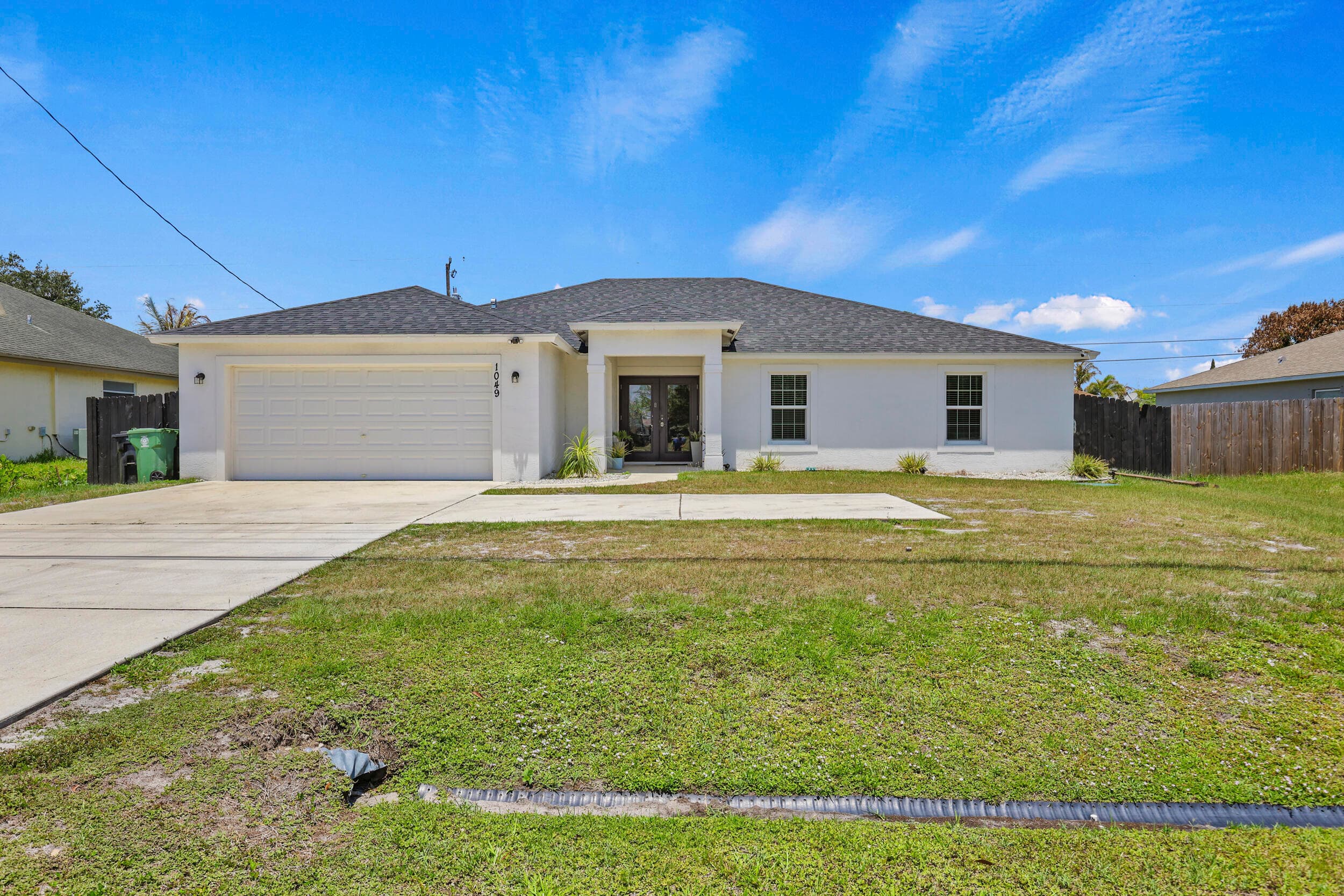 1049 SW Paar Drive, Port St. Lucie, FL 34953 — photo 1 of 46