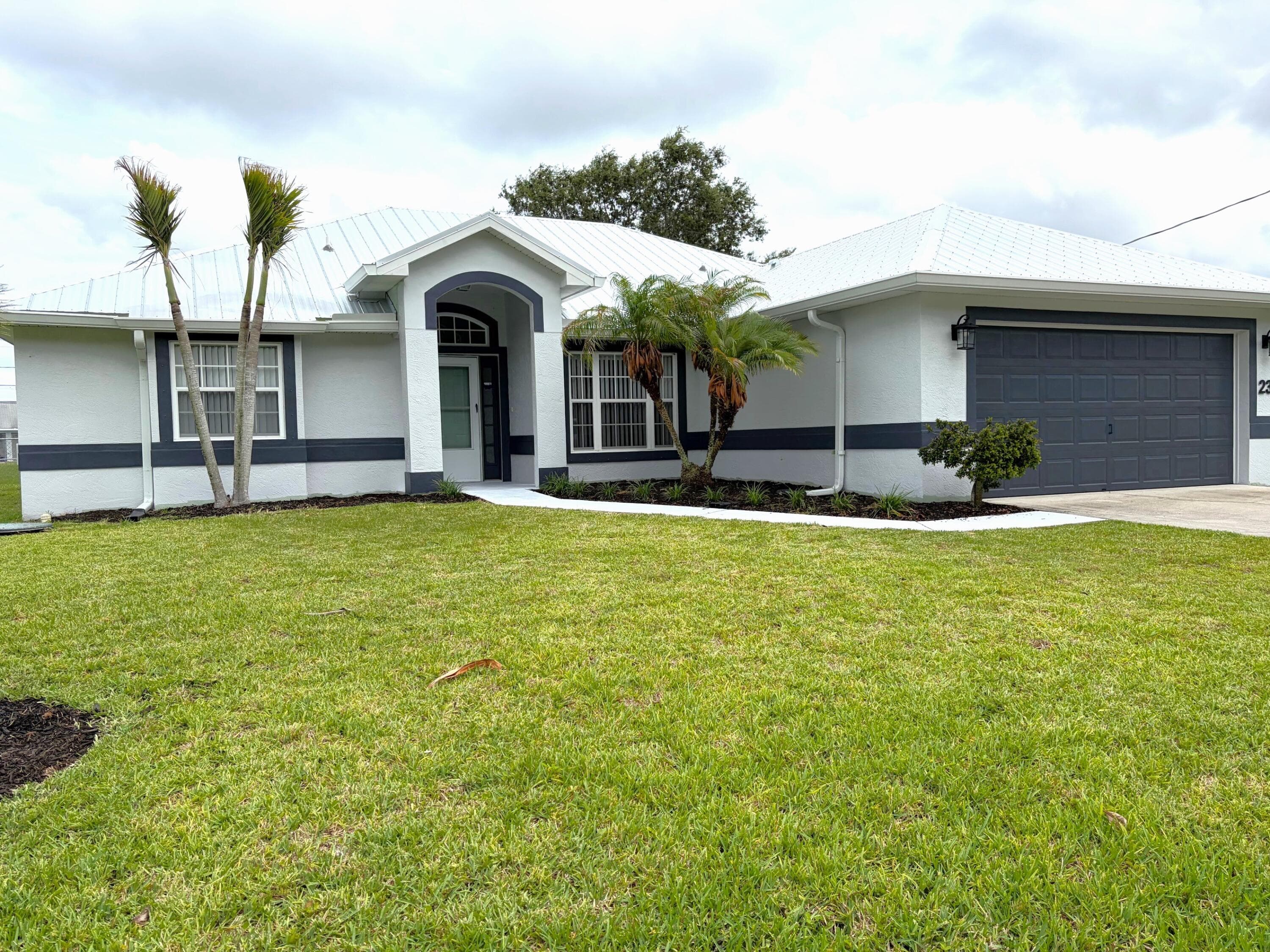 2367 SE Rock Springs Drive, Port St. Lucie, FL 34952 — photo 1 of 14