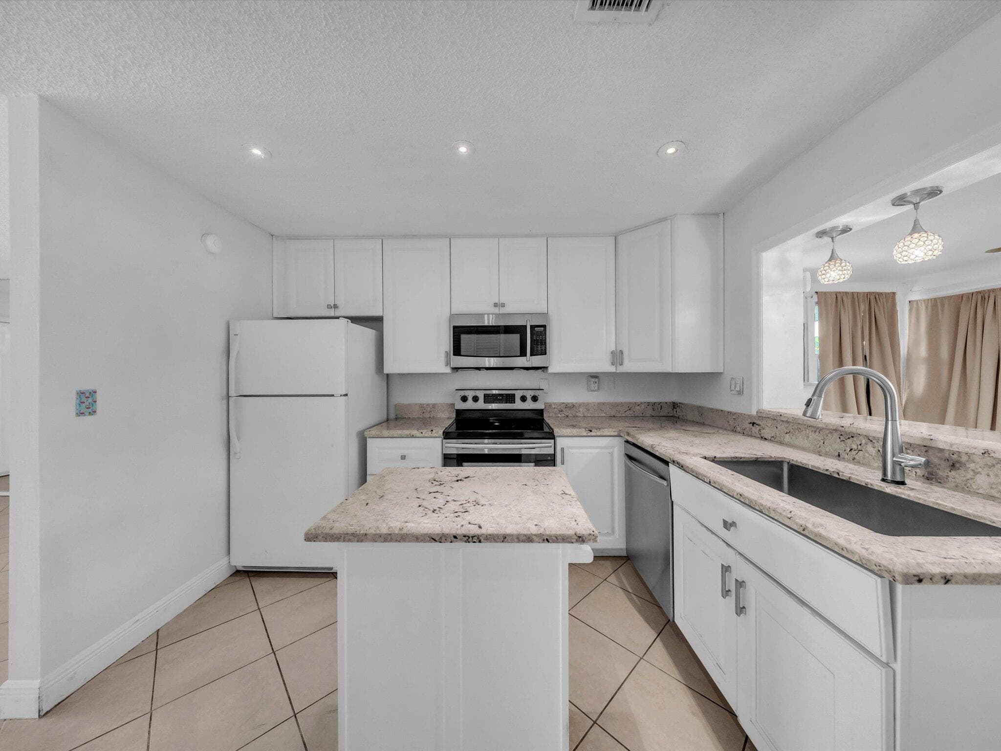 4935 NW 54th Street, Tamarac, FL 33319 — photo 10 of 28