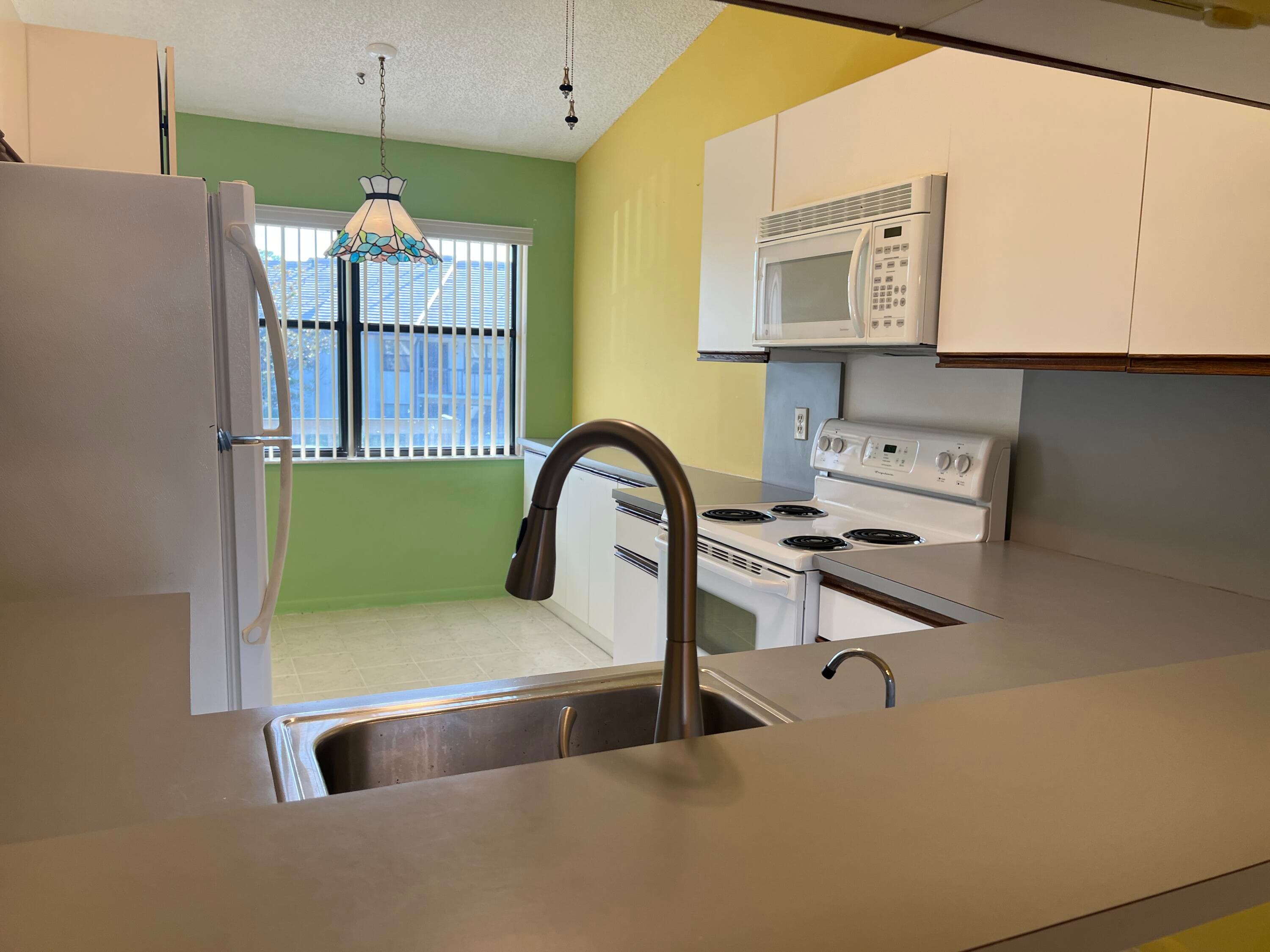 7649 Tahiti Lane 202, Lake Worth, FL 33467 — photo 1 of 12